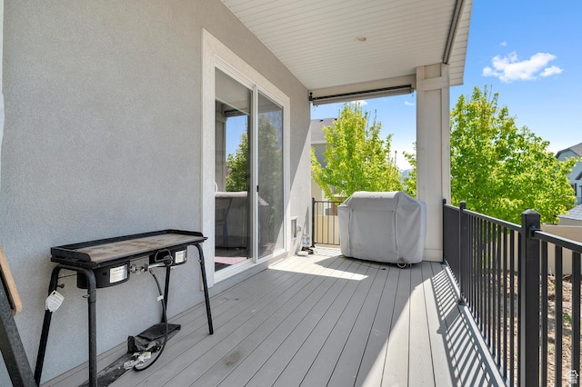 deck featuring a grill