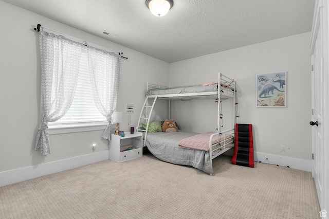 carpeted bedroom with baseboards