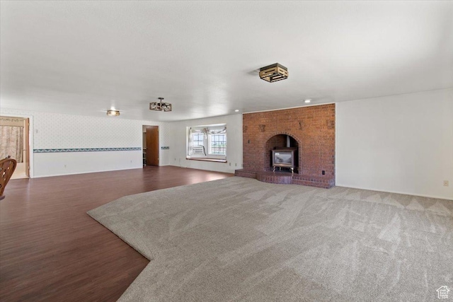 unfurnished living room featuring wood finished floors