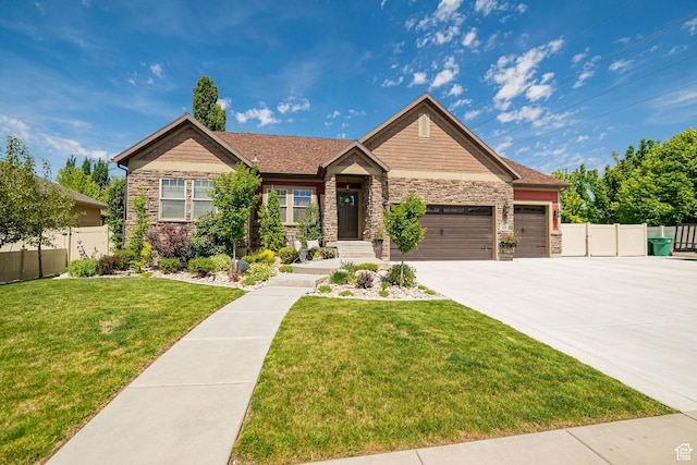 1608 W Boulder Creek Ln S, Layton, UT 84041 - craftsman-style home with stone siding, an attached garage, and driveway
