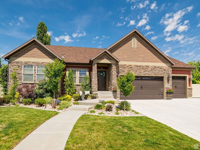1608 W Boulder Creek Ln S, Layton, UT 84041 - craftsman house with stone siding, a front yard, a garage, and concrete driveway