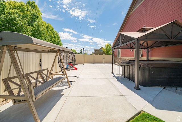 1608 W Boulder Creek Ln S, Layton, UT 84041 - view of patio with a hot tub and fence