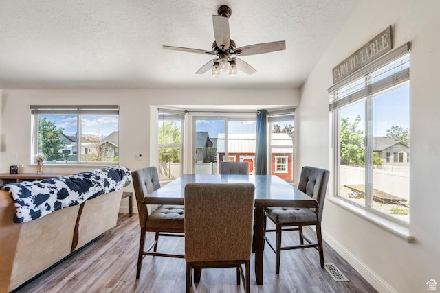 2177 N 130 W, Tooele, UT 84074 - dining room with a textured ceiling, wood finished floors, baseboards, and ceiling fan