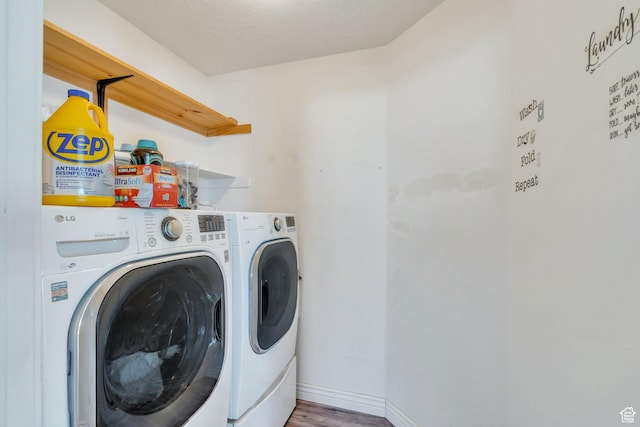 2177 N 130 W, Tooele, UT 84074 - laundry area with separate washer and dryer, wood finished floors, and baseboards
