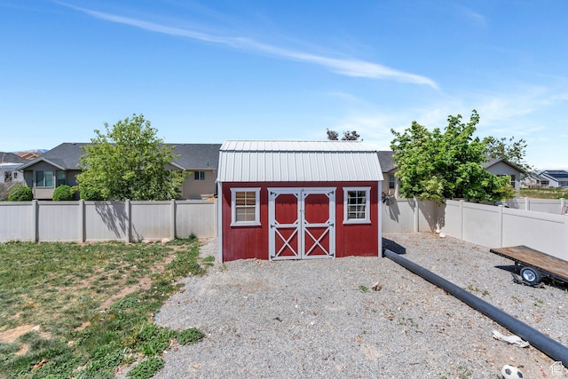 2177 N 130 W, Tooele, UT 84074 - view of shed with a fenced backyard and a residential view