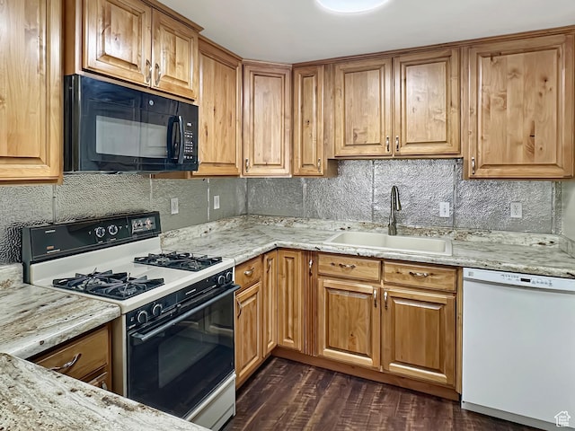 45 W 200 N, Castle Dale, UT 84513 - kitchen with black microwave, gas stove, dishwasher, a sink, and backsplash