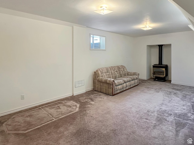 45 W 200 N, Castle Dale, UT 84513 - living area with a wood stove, carpet, and baseboards