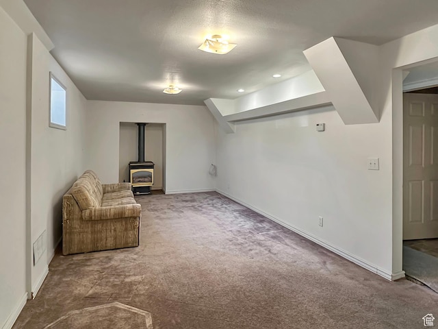 45 W 200 N, Castle Dale, UT 84513 - unfurnished room featuring carpet flooring, a wood stove, and baseboards