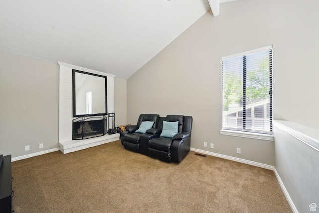 sitting room featuring carpet, a fireplace, and baseboards