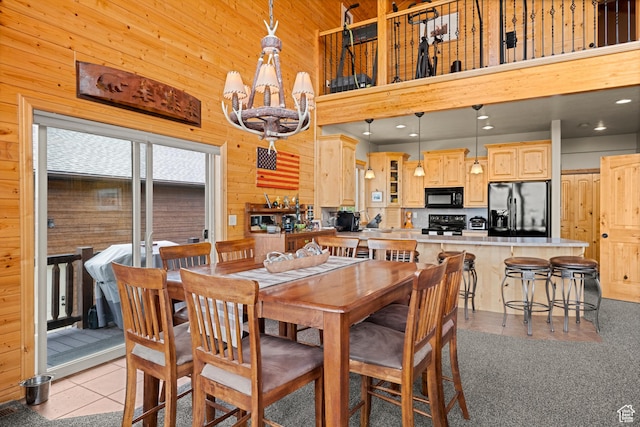 866 N Yarrow Cir Unit 38/39, Garden City, UT 84028 - dining space featuring wooden walls, a towering ceiling, and recessed lighting