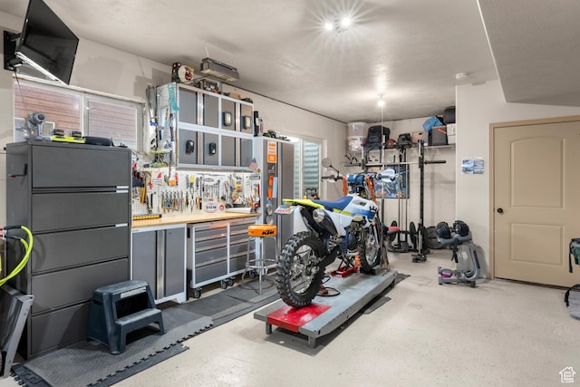 866 N Yarrow Cir Unit 38/39, Garden City, UT 84028 - garage featuring a workshop area