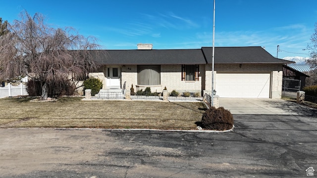 40 W 200 N, Santaquin, UT 84655 - ranch-style home featuring brick siding, a garage, concrete driveway, fence, and a chimney