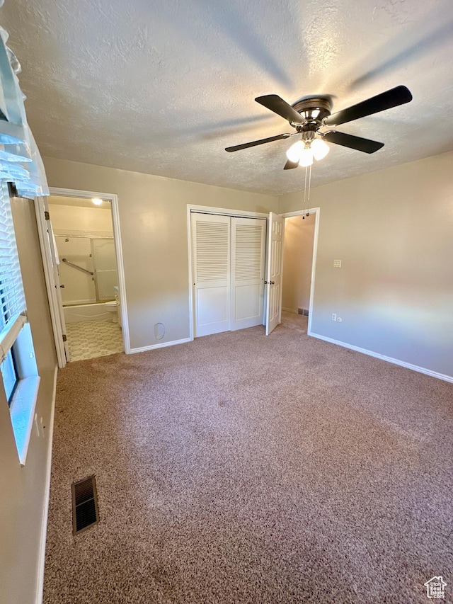 40 W 200 N, Santaquin, UT 84655 - unfurnished bedroom with baseboards, a textured ceiling, carpet floors, connected bathroom, and a closet