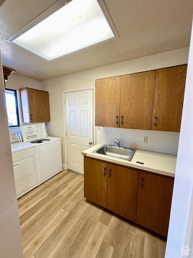 40 W 200 N, Santaquin, UT 84655 - kitchen with a sink, separate washer and dryer, light wood finished floors, light countertops, and brown cabinets