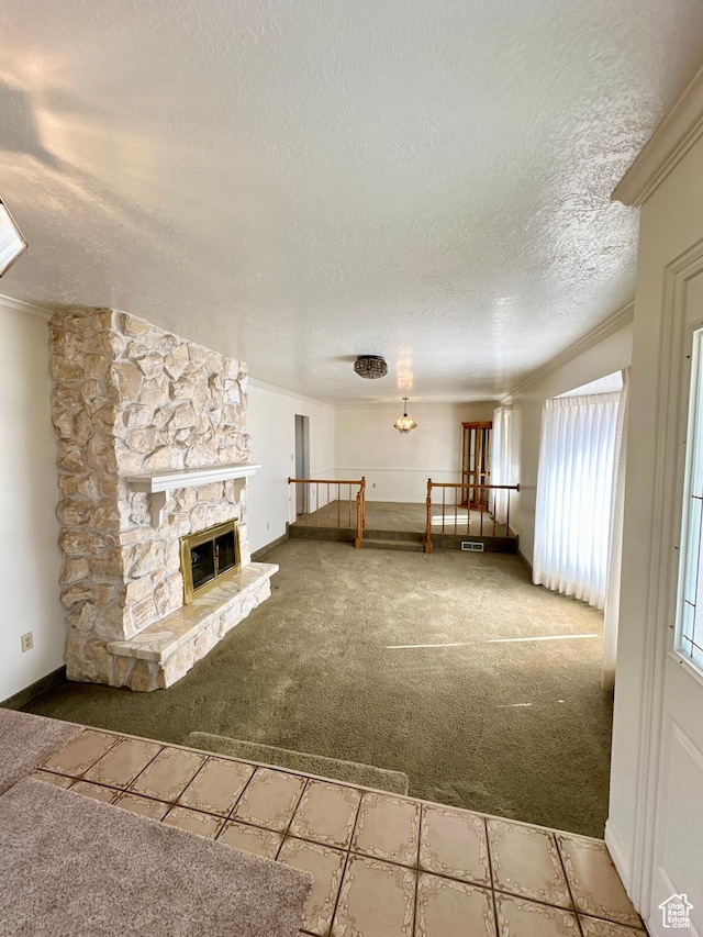 40 W 200 N, Santaquin, UT 84655 - unfurnished living room with carpet floors, ornamental molding, a textured ceiling, a fireplace, and baseboards