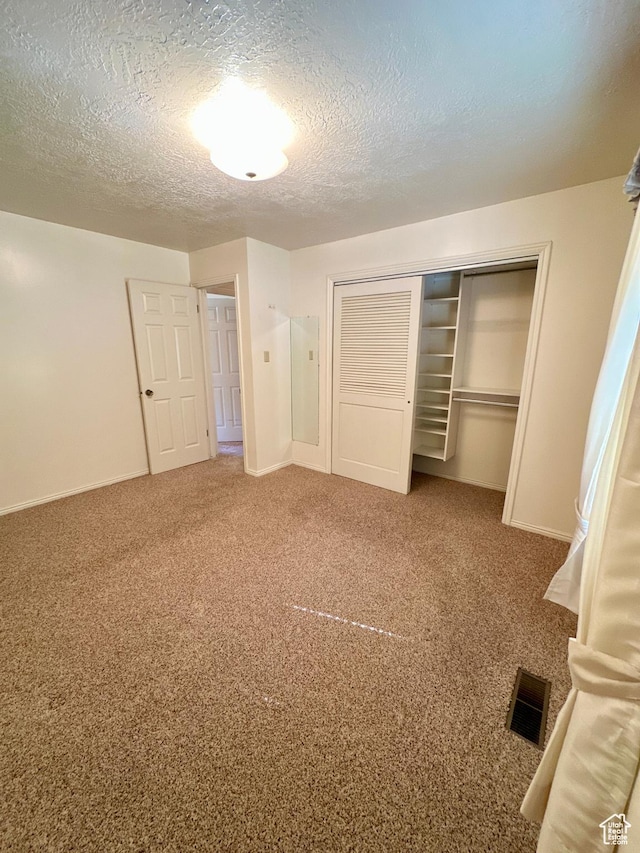 40 W 200 N, Santaquin, UT 84655 - unfurnished bedroom featuring a closet, carpet, baseboards, and a textured ceiling