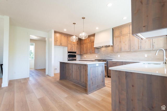 1699 N Siena Cir Unit 5, Pleasant Grove, UT 84062 - kitchen featuring custom exhaust hood, appliances with stainless steel finishes, tasteful backsplash, light wood finished floors, and a center island