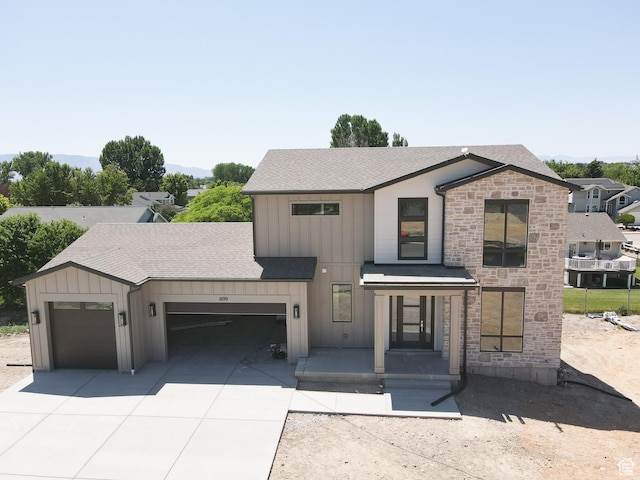 1699 N Siena Cir Unit 5, Pleasant Grove, UT 84062 - modern farmhouse featuring an attached garage, board and batten siding, driveway, and roof with shingles