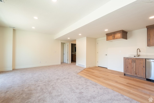1699 N Siena Cir Unit 5, Pleasant Grove, UT 84062 - kitchen featuring stainless steel dishwasher, recessed lighting, light carpet, light countertops, and brown cabinetry