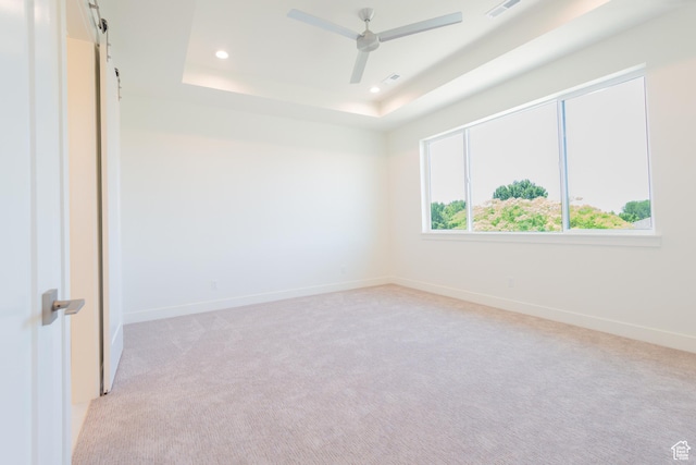 1699 N Siena Cir Unit 5, Pleasant Grove, UT 84062 - spare room featuring light colored carpet, recessed lighting, a raised ceiling, ceiling fan, and a barn door