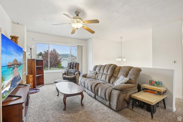617 E 980 N, Tooele, UT 84074 - carpeted living area featuring baseboards, a ceiling fan, and a chandelier