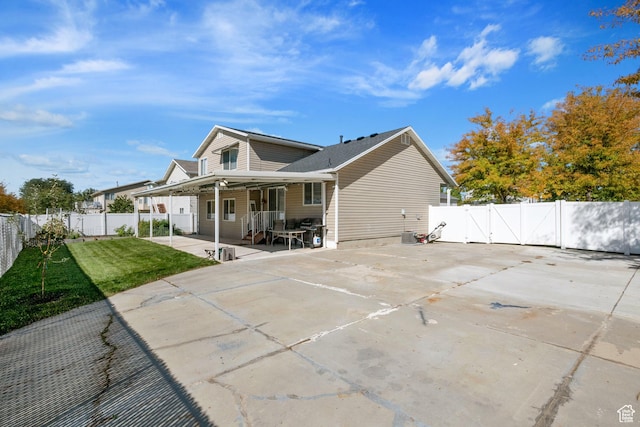 rear view of house with a patio