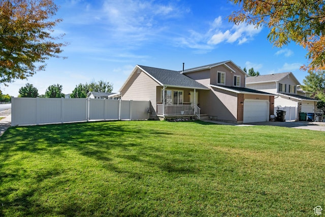 tri-level home featuring concrete driveway, a porch, and stucco siding