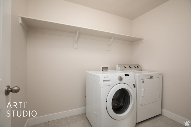 6637 W Terrace Sky Ln, West Jordan, UT 84081 - washroom featuring separate washer and dryer, light tile patterned flooring, and baseboards