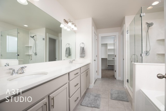 6637 W Terrace Sky Ln, West Jordan, UT 84081 - full bath featuring a stall shower, tile patterned floors, double vanity, a walk in closet, and recessed lighting