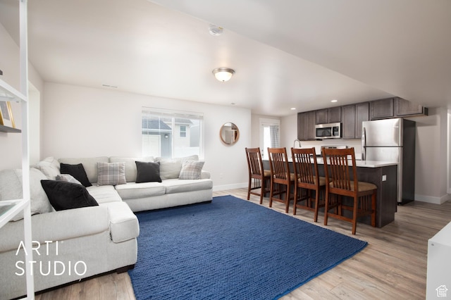 6637 W Terrace Sky Ln, West Jordan, UT 84081 - living room with light wood-style floors, baseboards, and recessed lighting