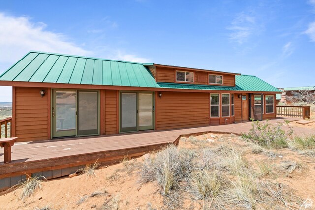 1 Pioneer Dr, La Sal, UT 84530 - back of property featuring a deck and metal roof