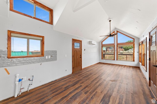 1 Pioneer Dr, La Sal, UT 84530 - unfurnished living room featuring a ceiling fan, wood finished floors, a wall unit AC, and vaulted ceiling