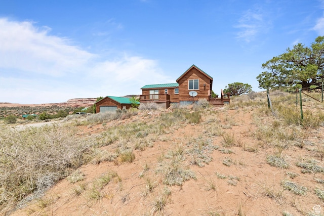1 Pioneer Dr, La Sal, UT 84530 - view of front of home featuring a garage