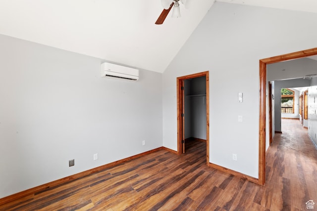 1 Pioneer Dr, La Sal, UT 84530 - unfurnished bedroom featuring a wall mounted air conditioner, wood finished floors, high vaulted ceiling, baseboards, and a spacious closet