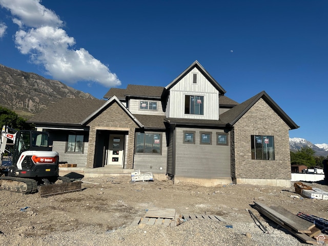 1768 N Siena Cir Unit 12, Pleasant Grove, UT 84062 - view of front facade with a mountain view, brick siding, and board and batten siding