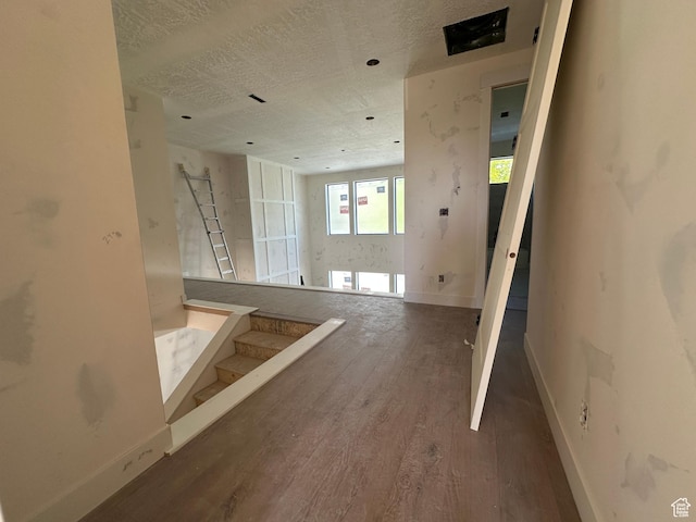 1768 N Siena Cir Unit 12, Pleasant Grove, UT 84062 - corridor featuring wood finished floors, baseboards, a textured ceiling, and stairs