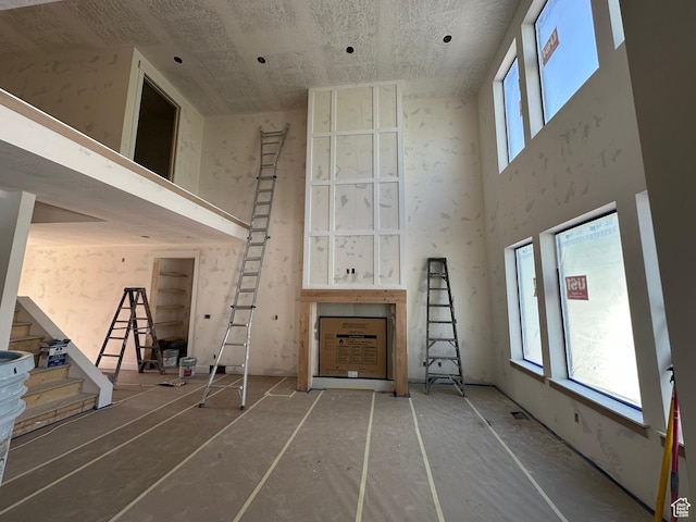 1768 N Siena Cir Unit 12, Pleasant Grove, UT 84062 - unfurnished living room featuring a towering ceiling