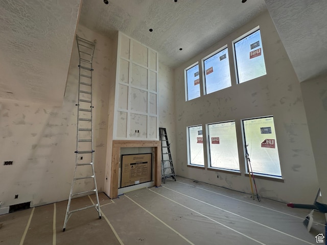 1768 N Siena Cir Unit 12, Pleasant Grove, UT 84062 - unfurnished living room featuring a textured ceiling