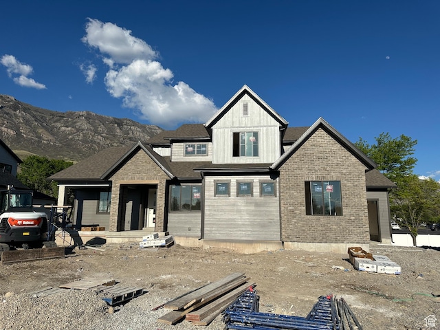 1768 N Siena Cir Unit 12, Pleasant Grove, UT 84062 - view of front of property featuring board and batten siding, a mountain view, and brick siding