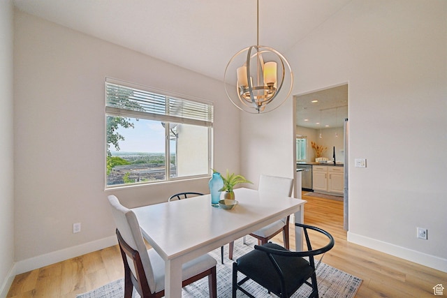 13994 S New Saddle Rd, Draper, UT 84020 - dining area with a chandelier, baseboards, light wood-style floors, and recessed lighting