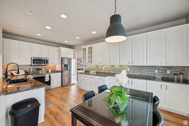 13994 S New Saddle Rd, Draper, UT 84020 - kitchen featuring stainless steel appliances, a sink, tasteful backsplash, white cabinets, and recessed lighting