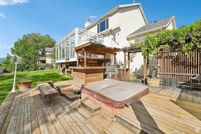 13994 S New Saddle Rd, Draper, UT 84020 - wooden deck featuring a covered hot tub, a lawn, and exterior kitchen