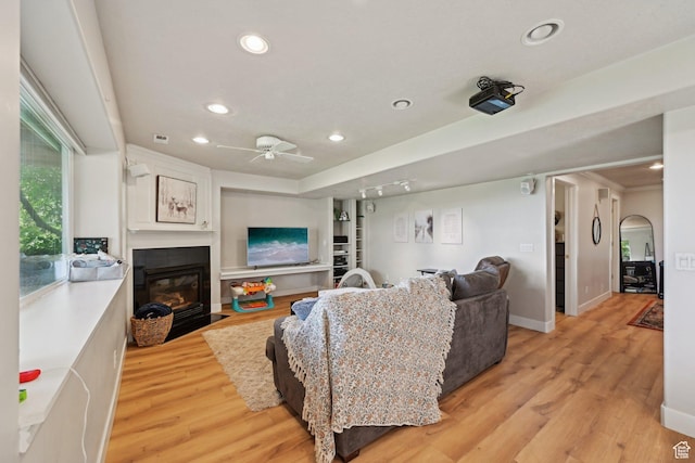 13994 S New Saddle Rd, Draper, UT 84020 - living room featuring recessed lighting, light wood finished floors, ceiling fan, a fireplace with flush hearth, and baseboards