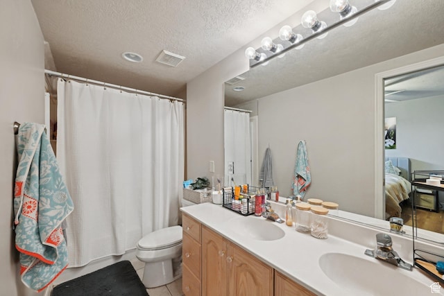 13994 S New Saddle Rd, Draper, UT 84020 - full bath with toilet, double vanity, a textured ceiling, tile patterned flooring, and ensuite bath