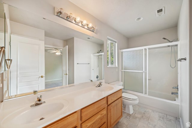 13994 S New Saddle Rd, Draper, UT 84020 - full bathroom featuring toilet, double vanity, bath / shower combo with glass door, and a ceiling fan