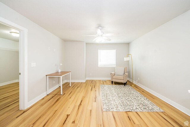 466 W 1595 N Unit 45-103, Logan, UT 84341 - sitting room with light wood-type flooring, a ceiling fan, and baseboards