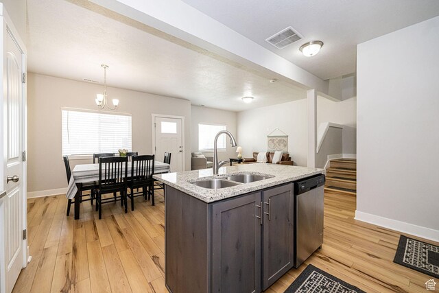 466 W 1595 N Unit 45-103, Logan, UT 84341 - kitchen with stainless steel dishwasher, a sink, light wood-style flooring, dark brown cabinetry, and light stone countertops