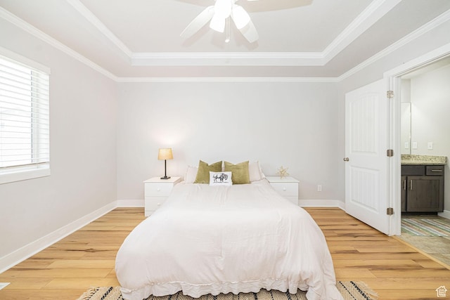 466 W 1595 N Unit 45-103, Logan, UT 84341 - bedroom featuring light wood-style flooring, a tray ceiling, ensuite bathroom, baseboards, and ornamental molding