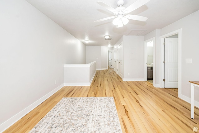 466 W 1595 N Unit 45-103, Logan, UT 84341 - empty room featuring light wood finished floors, ceiling fan, and baseboards
