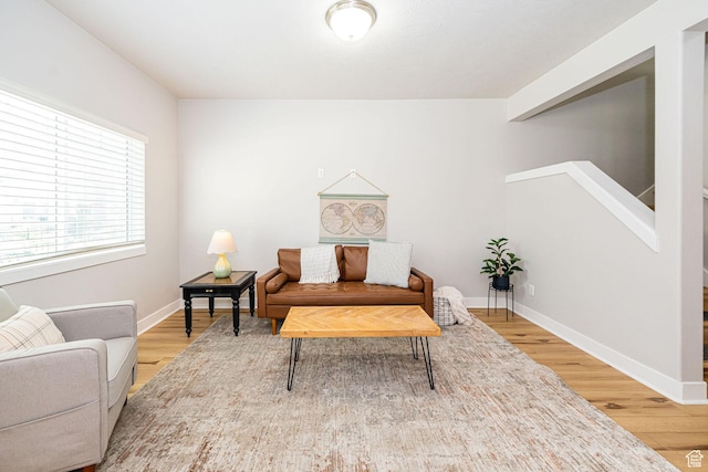466 W 1595 N Unit 45-103, Logan, UT 84341 - sitting room with wood finished floors, stairway, and baseboards